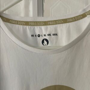 Official Olympic Paris 2024 White Short Sleeve Tee with Gold Accent